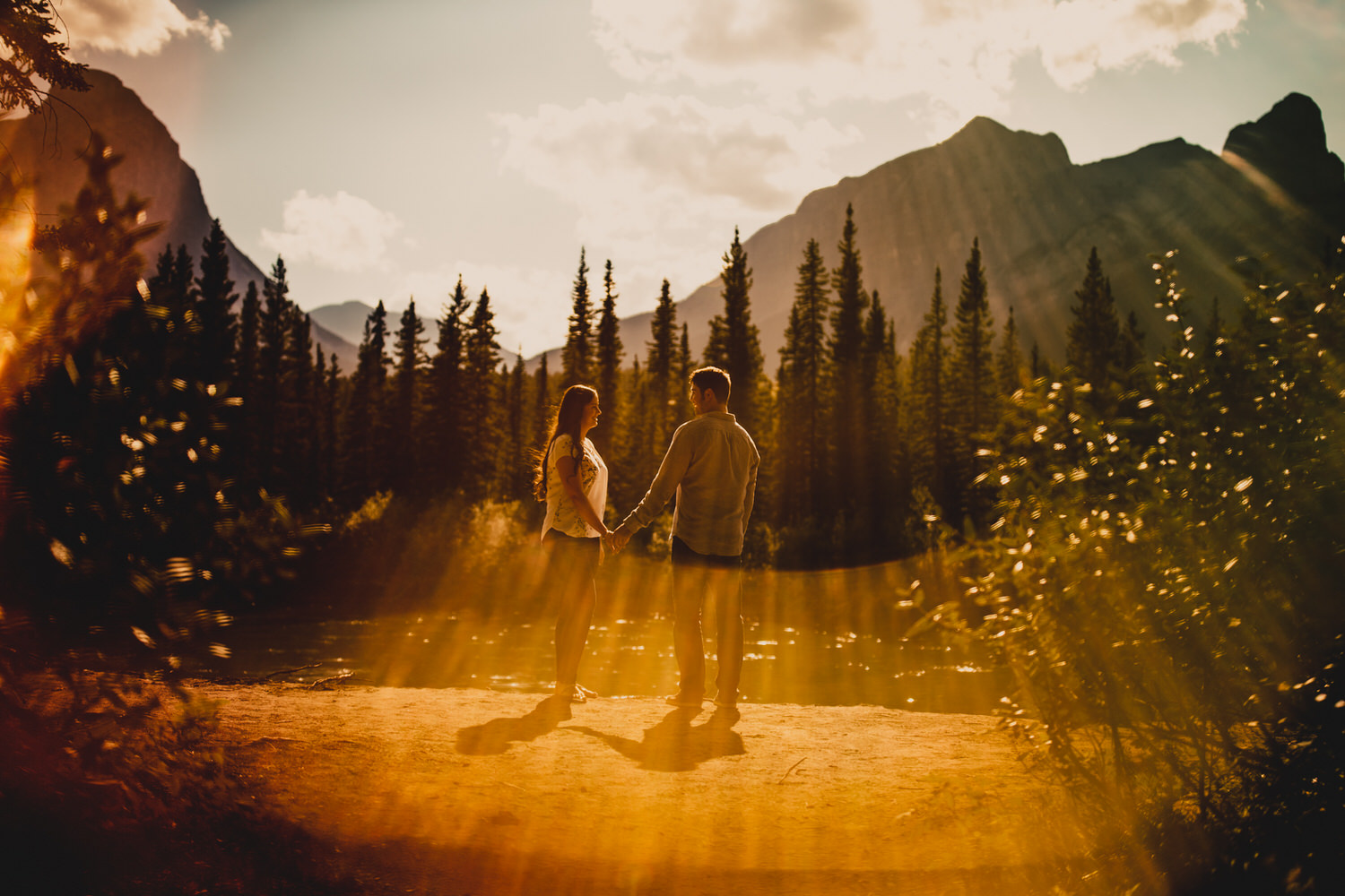 A couple looking at each during their engagement shoot in Canmore Alberta